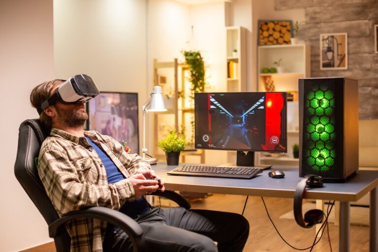 professional-gamer-man-using-vr-headset-play-powerful-pc-late-night-his-living-room_482257-22740