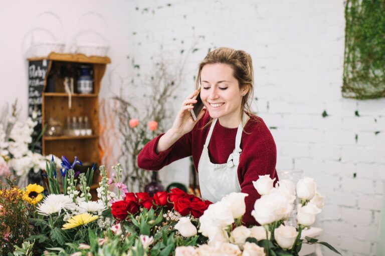 young-florist-speaking-smartphone_23-2147762198